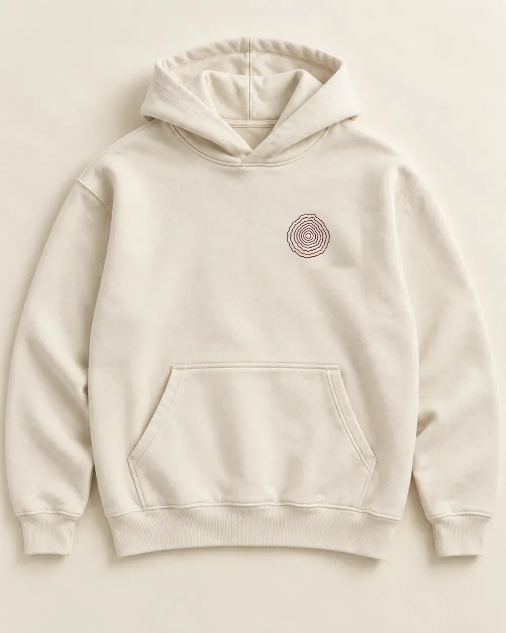 A heavyweight ecru hoodie laid flat, a small embroidery on the left chest: a mountain in eight plum contour lines, one of the lower lines in rust.